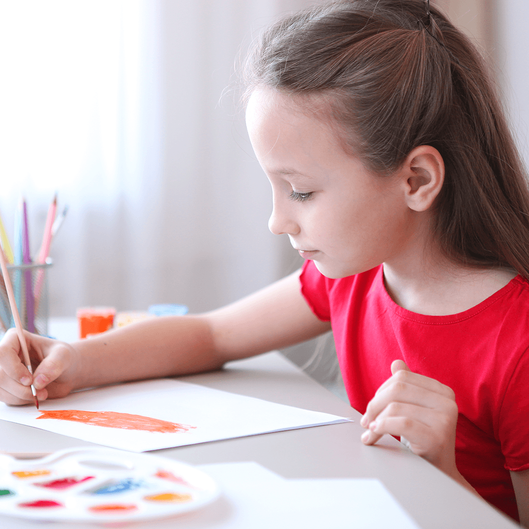 Girl crafting an invitation card – kids birthday tips