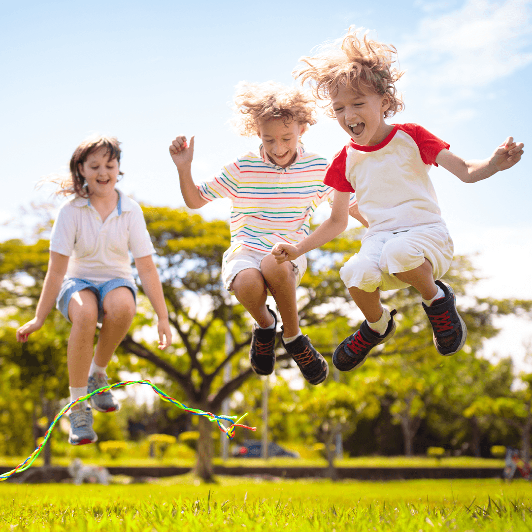 Children jumping rope together, building coordination through movement for kids